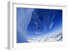 Skier Jumping from Mountain Ledge-null-Framed Photo