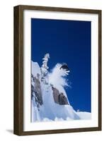 Skier Jumping from Mountain Ledge-null-Framed Photo