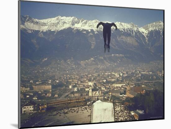 Skier Taking Off from the Bergisel Jump Hangs During Innsbruck Winter Olympics Competition-Ralph Crane-Mounted Photographic Print