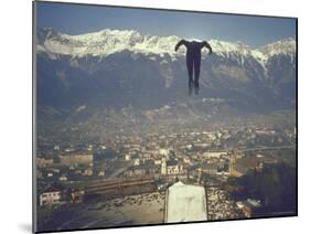 Skier Taking Off from the Bergisel Jump Hangs During Innsbruck Winter Olympics Competition-Ralph Crane-Mounted Photographic Print