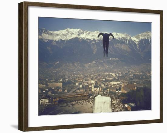 Skier Taking Off from the Bergisel Jump Hangs During Innsbruck Winter Olympics Competition-Ralph Crane-Framed Photographic Print