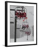 Skiers and Snowboarders Dressed as Santa Claus Ride up the Ski Lift-null-Framed Photographic Print