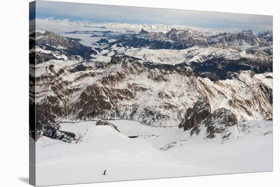 Skiers descend from the top of Marmolada in the Dolomites, Italy, Europe-Alex Treadway-Stretched Canvas