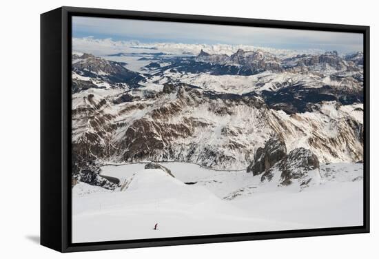 Skiers descend from the top of Marmolada in the Dolomites, Italy, Europe-Alex Treadway-Framed Stretched Canvas