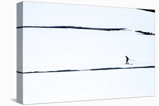 Skiers on the Sunwapta River in Jasper National Park, Alberta Canada-Richard Wright-Stretched Canvas