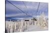 Skiers Ride Chairlift at Whitefish Mountain Resort, Montana, Usa-Chuck Haney-Stretched Canvas