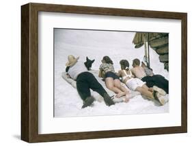 Skiers Sunbathing in Summer Fashions with Dog at Sun Valley Ski Resort, Idaho, April 22, 1947-George Silk-Framed Photographic Print