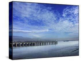 Skies over the Pier-Adrian Campfield-Stretched Canvas