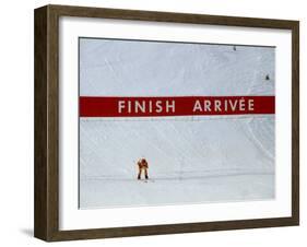 Skiier Arrives at the Finish Line-Paul Sutton-Framed Photographic Print