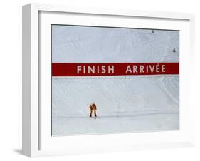 Skiier Arrives at the Finish Line-Paul Sutton-Framed Photographic Print