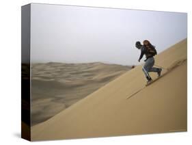 Skiing on Sanddunes, Morocco-Michael Brown-Stretched Canvas