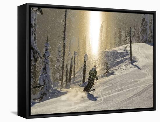 Skiing Through a Sundog on Corduroy Groomed Runs at Whitefish Mountain Resort, Montana, Usa-Chuck Haney-Framed Stretched Canvas