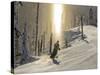Skiing Through a Sundog on Corduroy Groomed Runs at Whitefish Mountain Resort, Montana, Usa-Chuck Haney-Stretched Canvas