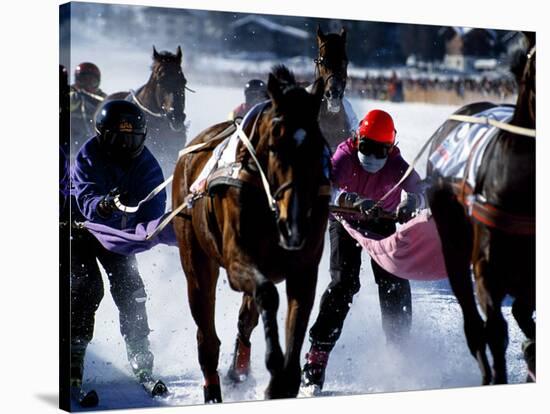 Skijouring, Skiing Behind a Race Horse at Full Gallop, on the Frozen Lake at St,Moritz, Switzerland-John Warburton-lee-Stretched Canvas