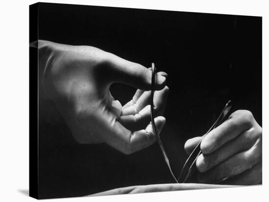 Skilled Hands of a Pediatric Surgeon at John Hopkins Hospital-null-Stretched Canvas