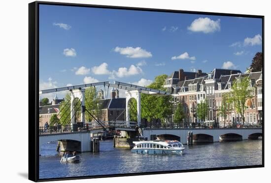 Skinny Bridge (Magere Brug) on Amstel River, Amsterdam, Netherlands-Ian Trower-Framed Stretched Canvas