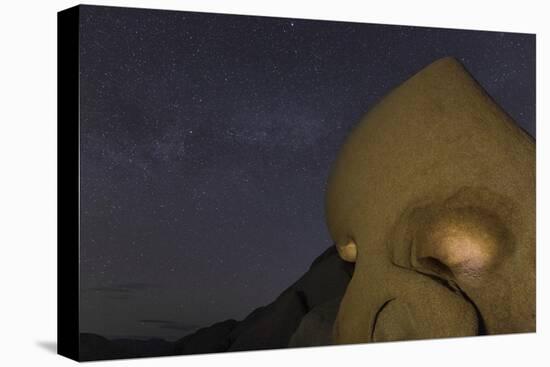 Skull Rock Lit Up at Night in Joshua Tree NP, California, USA-Chuck Haney-Stretched Canvas