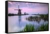 Sky is tinged with purple at dawn on the windmills reflected in the canal Kinderdijk Rotterdam Sout-ClickAlps-Framed Stretched Canvas