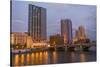 Skyline at dusk, on the Grand River, Grand Rapids, Michigan. USA.-Randa Bishop-Stretched Canvas