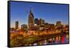 Skyline at Dusk over the Cumberland River in Nashville Tennessee-Chuck Haney-Framed Stretched Canvas