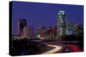 Skyline of Raleigh, NC at night-null-Stretched Canvas