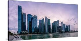 Skyscrapes line Marina Bay at dusk, Singapore, Southeast Asia, Asia-Logan Brown-Stretched Canvas