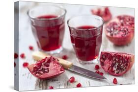 Sliced Pomegranates, Cores and Glasses with Pomegranate Juice-Jana Ihle-Stretched Canvas