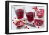 Sliced Pomegranates, Cores and Glasses with Pomegranate Juice-Jana Ihle-Framed Photographic Print