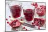 Sliced Pomegranates, Cores and Glasses with Pomegranate Juice-Jana Ihle-Mounted Photographic Print