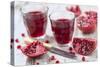 Sliced Pomegranates, Cores and Glasses with Pomegranate Juice-Jana Ihle-Stretched Canvas