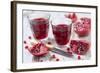 Sliced Pomegranates, Cores and Glasses with Pomegranate Juice-Jana Ihle-Framed Photographic Print