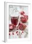 Sliced Pomegranates, Seeds and Glass with Pomegranate Juice-Jana Ihle-Framed Photographic Print