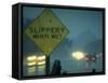 Slippery When Wet Sign in Fore with Traffic in Background in Rain on California Highway 14-Ralph Crane-Framed Stretched Canvas