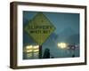 Slippery When Wet Sign in Fore with Traffic in Background in Rain on California Highway 14-Ralph Crane-Framed Photographic Print