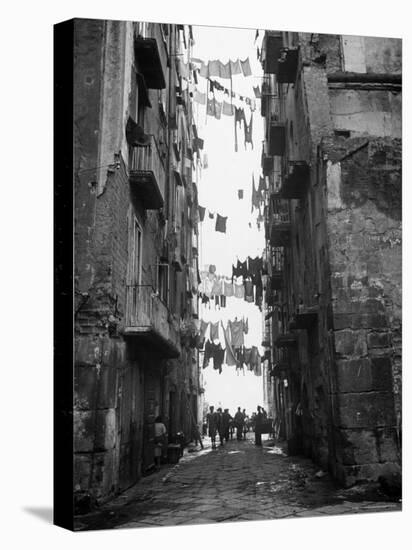 Slum Street with Laundry Hanging Between Buildings-Alfred Eisenstaedt-Stretched Canvas