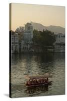 Small boat on Lake Pichola, Udaipur, Rajasthan, India.-Inger Hogstrom-Stretched Canvas