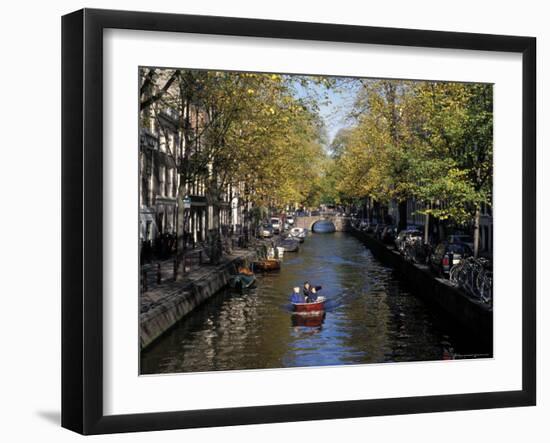 Small Boat on Tree-Lined Oudezijds Achtenburg Wal Canal in the Autumn, Amsterdam, the Netherlands-Richard Nebesky-Framed Photographic Print