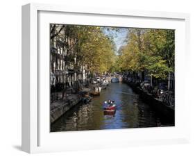 Small Boat on Tree-Lined Oudezijds Achtenburg Wal Canal in the Autumn, Amsterdam, the Netherlands-Richard Nebesky-Framed Photographic Print
