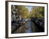 Small Boat on Tree-Lined Oudezijds Achtenburg Wal Canal in the Autumn, Amsterdam, the Netherlands-Richard Nebesky-Framed Photographic Print