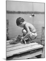 Small Boy Catching Fish with a Net-null-Mounted Photographic Print