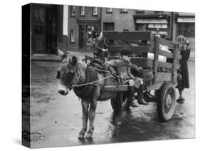 Small Boy Waits Patiently on a Donkey Cart in the Market Place at Kildare Co Kildare Ireland-null-Stretched Canvas