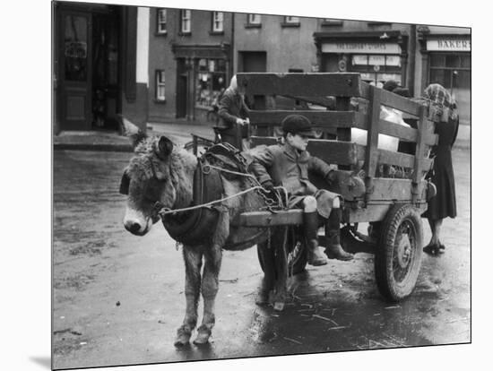 Small Boy Waits Patiently on a Donkey Cart in the Market Place at Kildare Co Kildare Ireland-null-Mounted Photographic Print