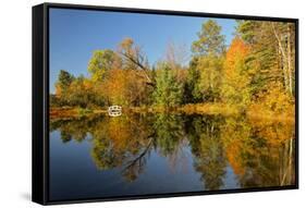 Small bridge and autumn colors reflected on tranquil pond, New Hampshire-Adam Jones-Framed Stretched Canvas