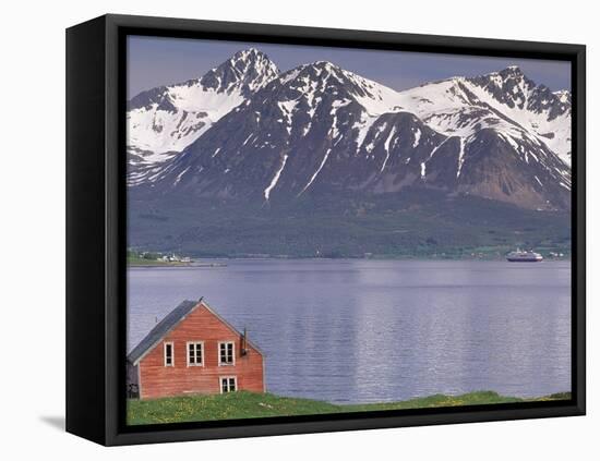 Small Farm Building with Mountains, Harstad, Norway-Walter Bibikow-Framed Stretched Canvas