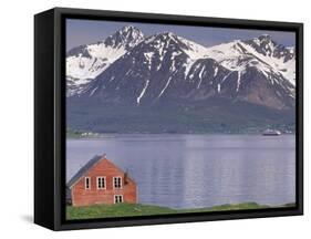 Small Farm Building with Mountains, Harstad, Norway-Walter Bibikow-Framed Stretched Canvas