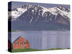 Small Farm Building with Mountains, Harstad, Norway-Walter Bibikow-Stretched Canvas