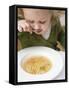 Small Girl Eating Soup with Teddy Bear Pasta-null-Framed Stretched Canvas