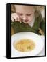 Small Girl Eating Soup with Teddy Bear Pasta-null-Framed Stretched Canvas