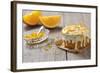 Small Orange Cake with White Icing on Wooden Table-Jana Ihle-Framed Photographic Print