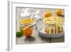 Small Orange Cake with White Icing on Wooden Table-Jana Ihle-Framed Photographic Print